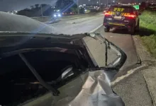 Viatura e agentes de segurança em rodovia